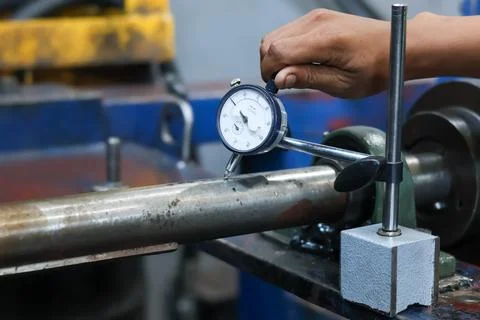 Quality Control Inspection Using Dial Indicator On Metal Rod. Stock Photos