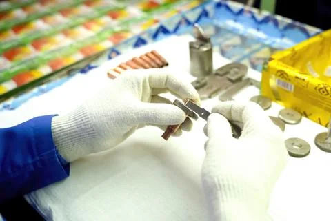 Quality control operator checks the chuck parts for compliance with the dim.. Stock Photos