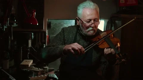 Quality control of string instruments night Stock Footage 167112875