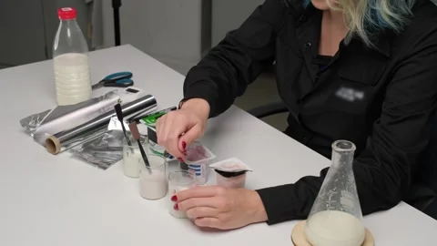 Quality Control Testing of Milk in Laboratory Stock Footage 306322762