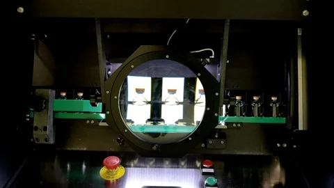 Quality Control vials for injection. Individual checks vial under a microscope.  Stock Footage 127569003