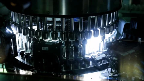 Quality Control vials for injection. Individual checks vial under a microscope.  Stock Footage 127569828