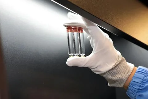 Quality Control vials for injection. Individual checks vial under a microscop 스톡 사진