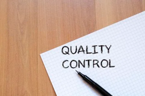 Quality control write on notebook Stock Photos