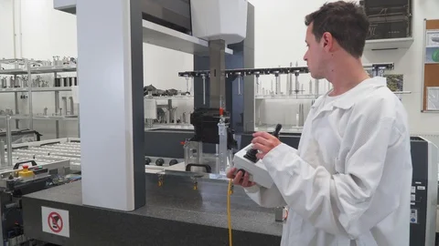 Quality engineer control using remote control machine for accurate 3d Video stock 129766954