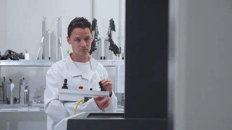 Quality engineer programs a machine for 3D measurement of plastic casting in the Video stock 129966990