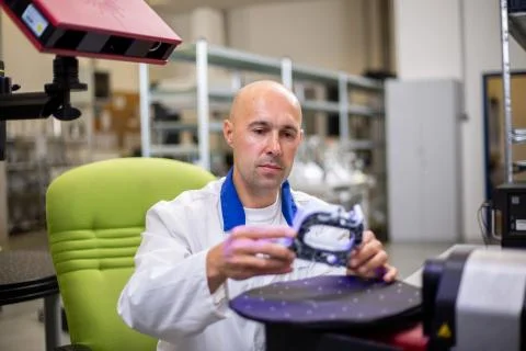 Quality engineer, scanning components by professional optical 3D scanner with a Stock Photos