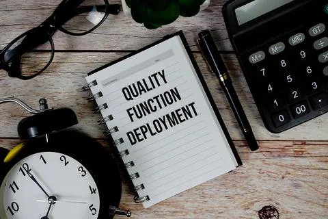 Quality Function Deployment (QFD) text on notepad, Business and Financial c.. Stock Photos