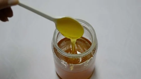 Quality Honey Pouring a Continuous Stream Stock Footage 81800062