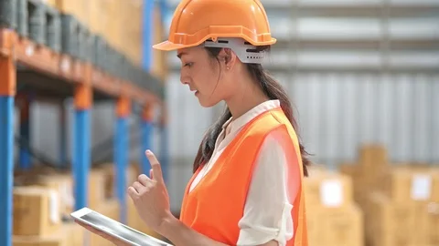Quality inspector in small warehouse. Stock Footage 92402028