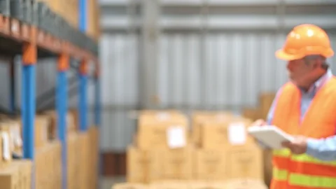 Quality inspector in small warehouse. Stock Footage 92403023
