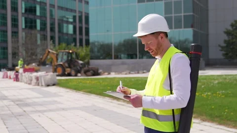 Quality Inspector Taking Notes at Construction Site Stock Footage 278645129