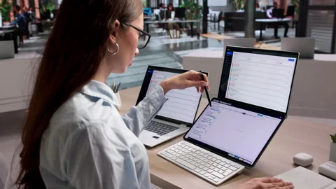 Quality Manager Reviewing Software Dashboard For Corrective Actions Stock Footage 335880310