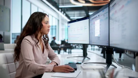 Quality Manager Reviews Compliance Reports On Desktop Computer Stock Footage 335459141