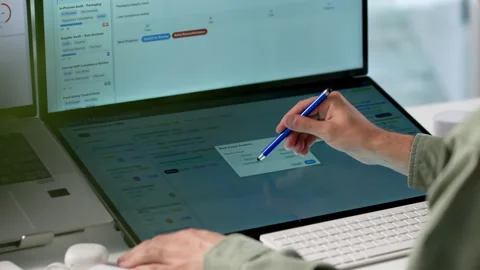 Quality Manager Reviews Compliance Reports On Laptop Stock Footage 339890957