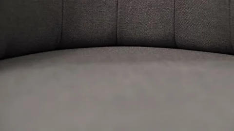 Quality stitching and expensive upholstered chair textiles in shades Stock Footage 219921892