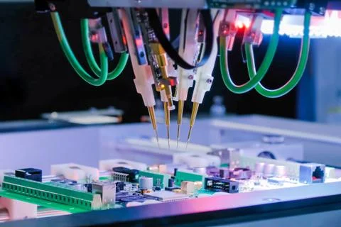 Quality testing of printed circuit boards - flying probe test at factory Stock Photos
