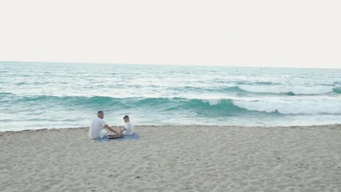 Quality Time at the Beach A Father and Sons Special Day by the Beautiful Sea Stock Footage 282994262