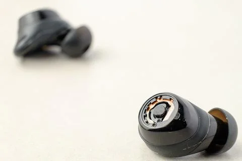 Quality wireless earbuds showcase modern design and sound technology 스톡 사진