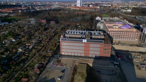 Quantum computer in datacenter building facility. Dramatic aerial view drone Stock Footage 326020299