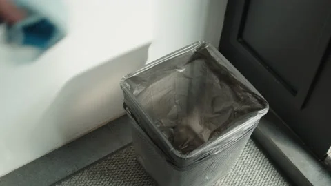 Quarantine is over concept. Young happy woman throwing away protective face mask Stock Footage 130653516