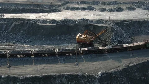 Quarry aerial view. opencast mining operations. excavator loading minerals. open Stock Footage 143970211