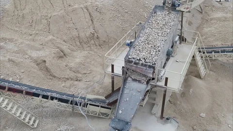 Quarry C Equipment Processing of Stone Falling from a Moving Conveyor Belt Stock Footage 122007346