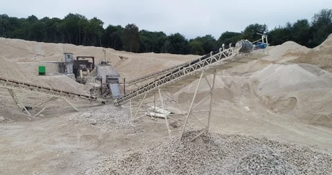 Quarry C Equipment Processing of Stone Falling from a Moving Conveyor Belt Stock Footage 122007398