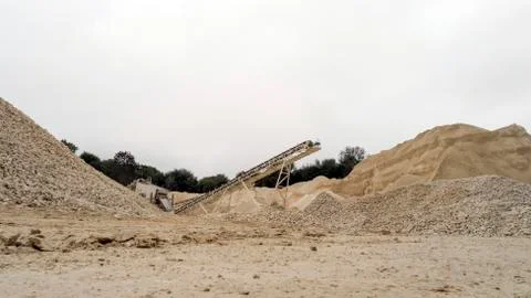 Quarry C Equipment Processing of Stone Falling from a Moving Conveyor Stock Photos