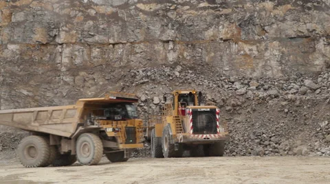 Quarry Digger Excavator loading Dumper Truck Version 1 Stock Footage 33608236