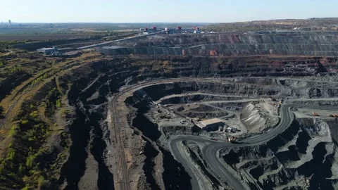 Quarry iron ore mining quarry quarry trucks metallurgical production huge pit Stock Footage 162171706