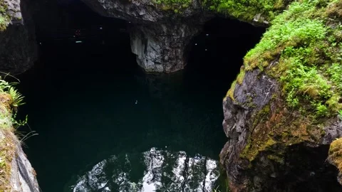 Quarry lake reflecting forest and cliffs. Stock Footage 342387732