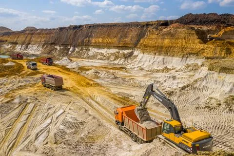 Quarry, mining and construction, excavators and trucks, view from above Stock Photos