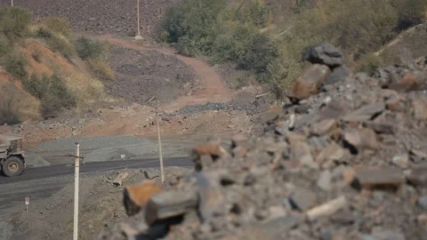 Quarry, mining of iron ore. Coming belaz refocus in the foreground ore. Video stock 101783069