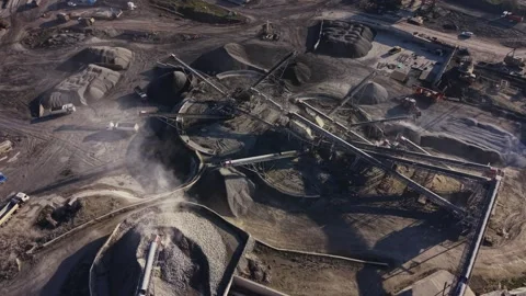 Quarry operations showing mining equipment and materials movement Stockbeeldmateriaal 329996783