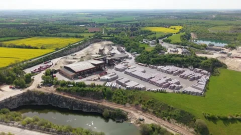 Quarry pit and brick manufacturing yard with block stockpiles in an aerial view Stock Footage 346653342