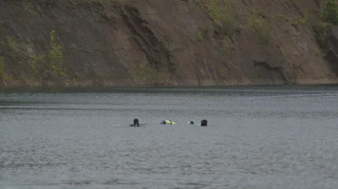 Quarry Scuba Divers on surface Stock Footage 48578333