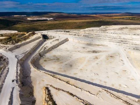 Quarry shows large open space with rock formations and pathways in a rural .. Stock Photos