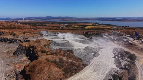 Quarry site with machines working and dust rising in a rural area Stock Footage 344539292