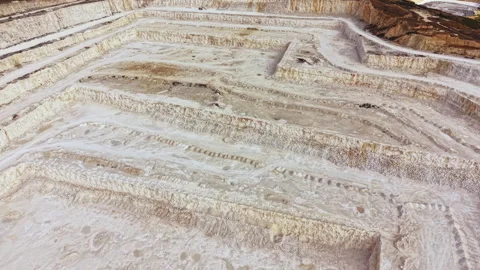 Quarry site showing cuts and layers of earth from mining activity in a rural Stock Footage 345457921