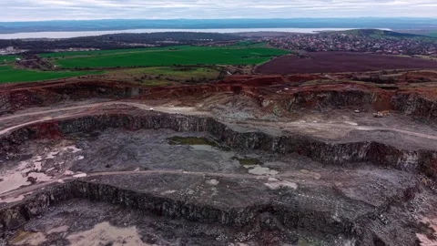 Quarry site showing granite extraction process in open land Stock Footage 337934701
