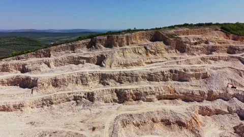 Quarry site showing layers of rock during a sunny day Stock Footage 338276014