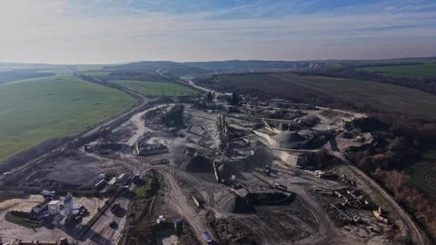 Quarry site showing mining operations and heavy machinery at work Видео 329998505