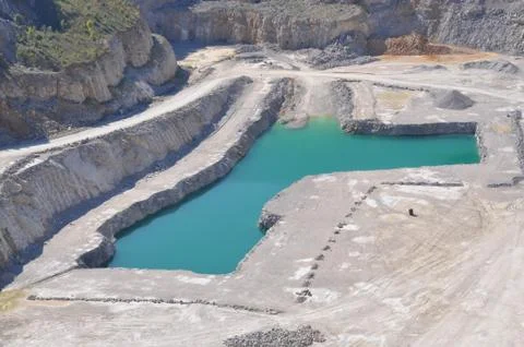 Quarry stone mining with the lake Stock Photos