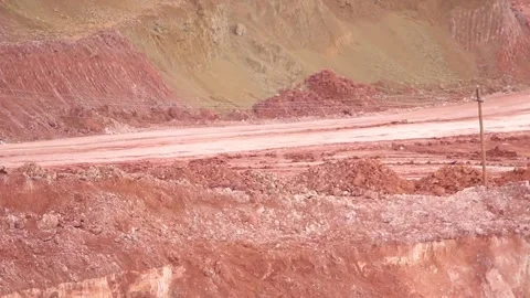 In a quarry, two dump trucks drive towards each other. Stock Footage 122216931