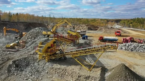 Quarry work, excavators, stone crusher and quarry loaders. Drone 4k Stock Footage 236398009