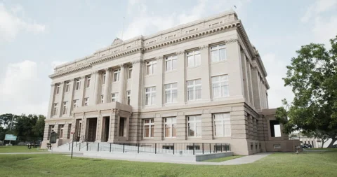 Quarter view of the Cameron County courthouse building in Brownsville, Stock Footage 202448206