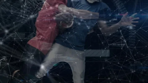 Quarterback scanning left for receiver as defender closing and tackling him amid Stock Footage 313677018