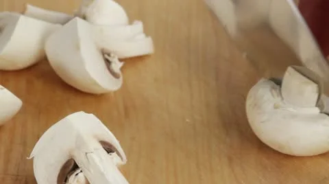 Quartering button mushrooms Stock Footage 24667433