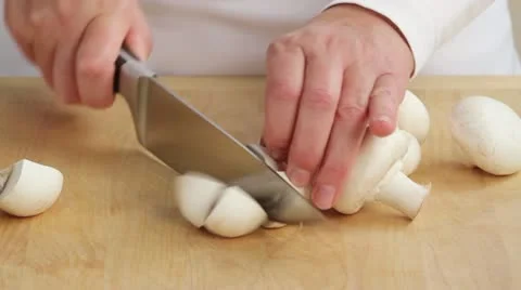 Quartering button mushrooms Stock Footage 24667445